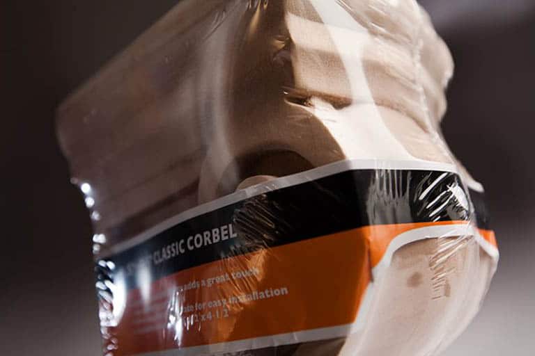 Classic corbel wrapped in plastic packaging.