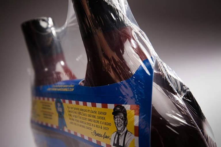 Packaged bottles with illustrated label, close-up.