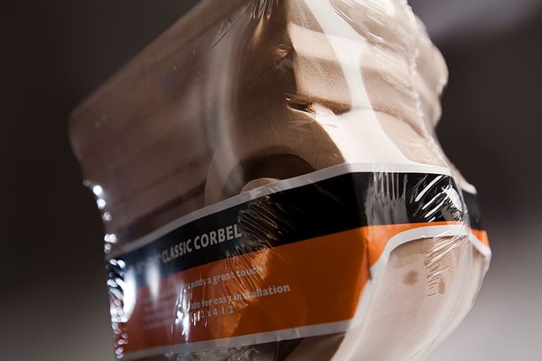 Packaged classic corbel wrapped in plastic.