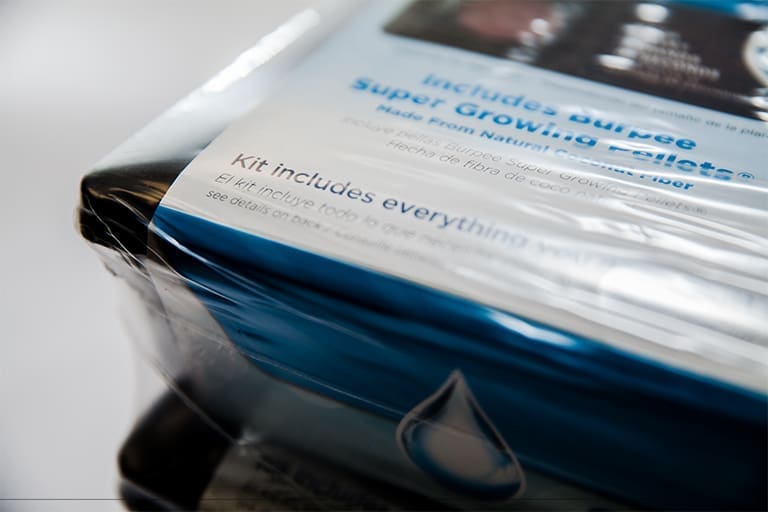 Plastic-wrapped product package with visible text.