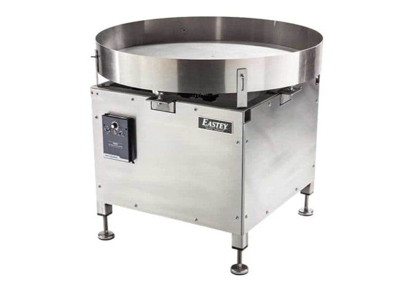 Stainless steel industrial turntable with control panel.